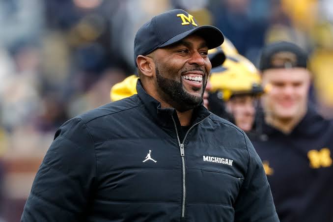 TOUCH DOWN FEW MINUTES AGO: Head coach of Michigan wolverines Sherrone Moore have just signed a contract of $50.7 billion dollars with the president of USA for……read more..