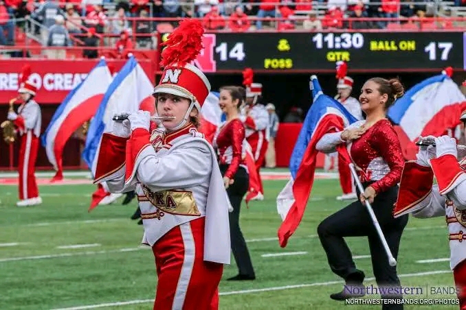 Lincoln, NE — In an electrifying announcement that has sent shockwaves through the world of music and collegiate athletics, the Nebraska Cornhusker Marching Band has been officially named the #1 marching band in the world by ESPN. The decision comes in the wake of a spellbinding international performance that left audiences in awe and judges speechless — a moment now being hailed as one of the most iconic in marching band history.…See More   